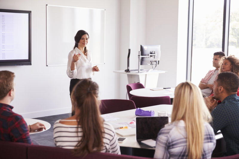 University Students Attending Lecture On Campus